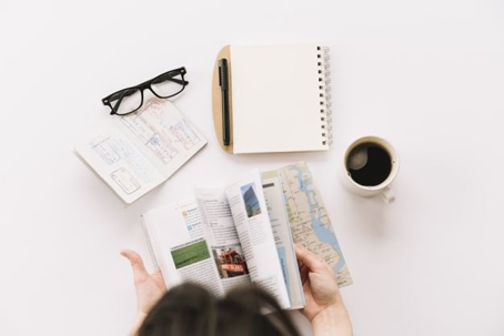 person looking through map