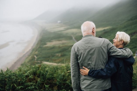 elderly couple hugging