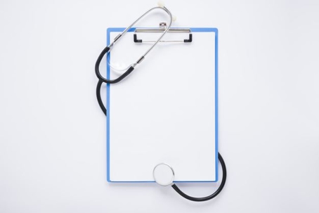 stethoscope wrapped around a white board