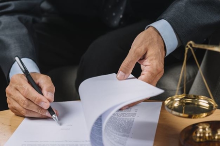 lawyer signing contract